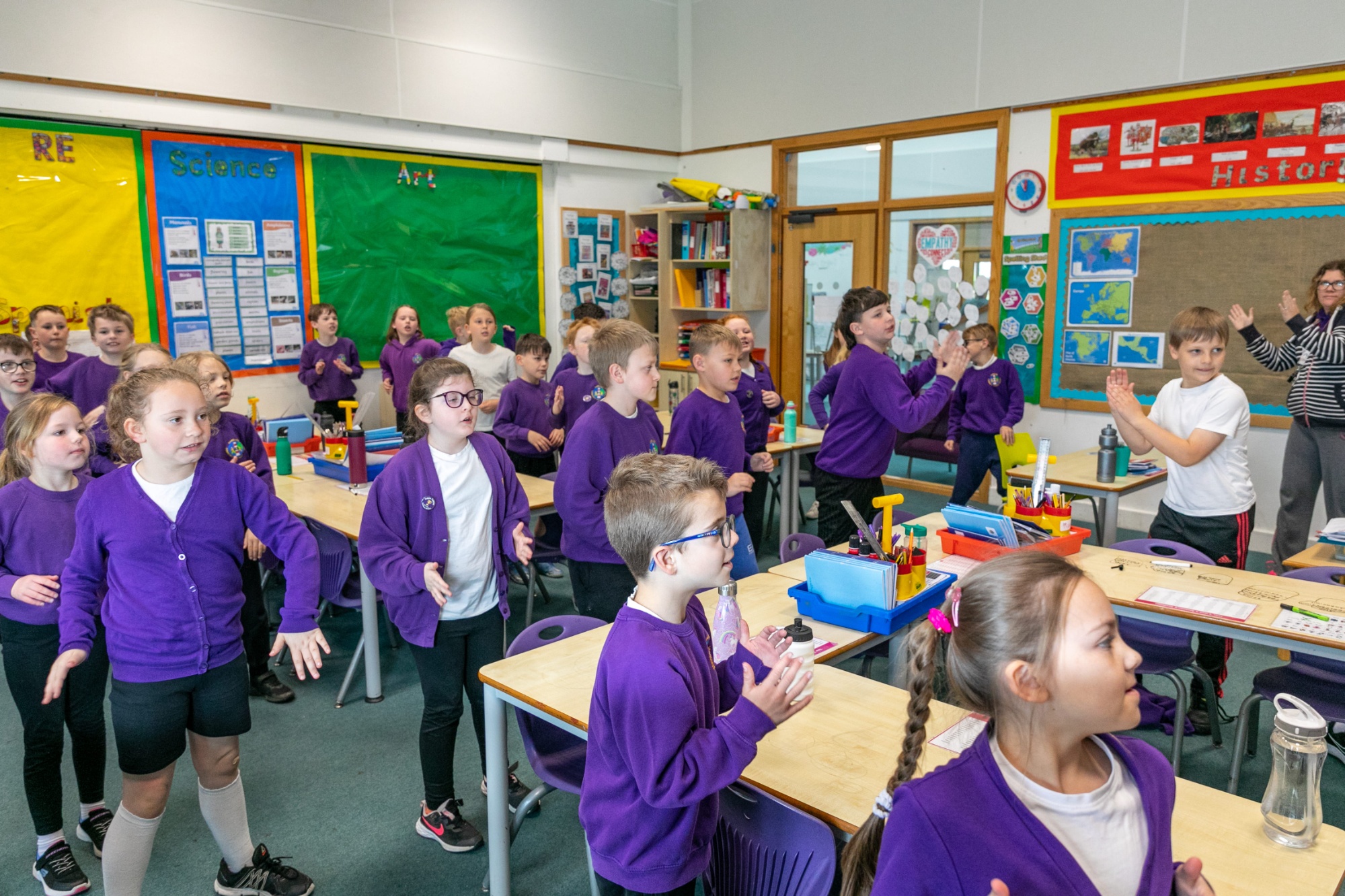 children dancing in classroom